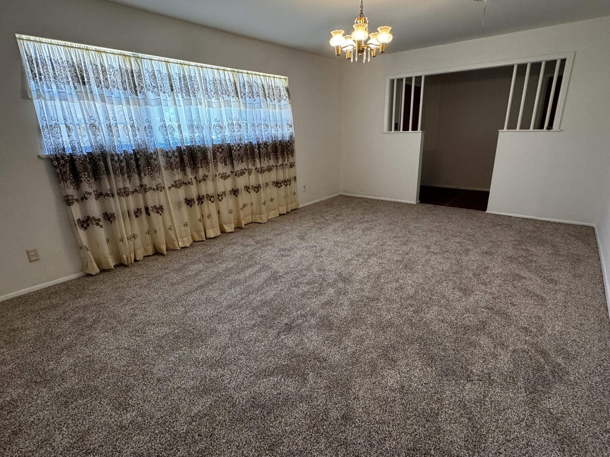 1209 Garland Plainview, TX 79072 - Photo 6 of 37 a view of a room with furniture and chandelier