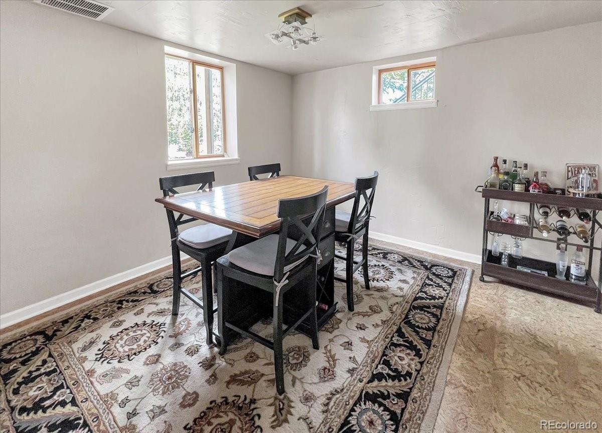 22155 Cook Lane Morrison, CO 80465 - Photo 19 of 28 a view of a dining room with furniture and a window