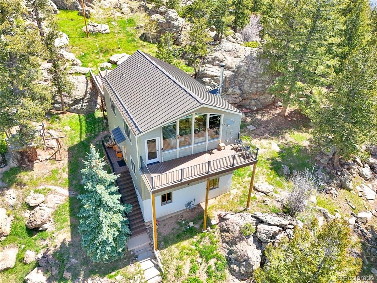 22155 Cook Lane Morrison, CO 80465 - Photo 2 of 28 a aerial view of a house with a yard and potted plants