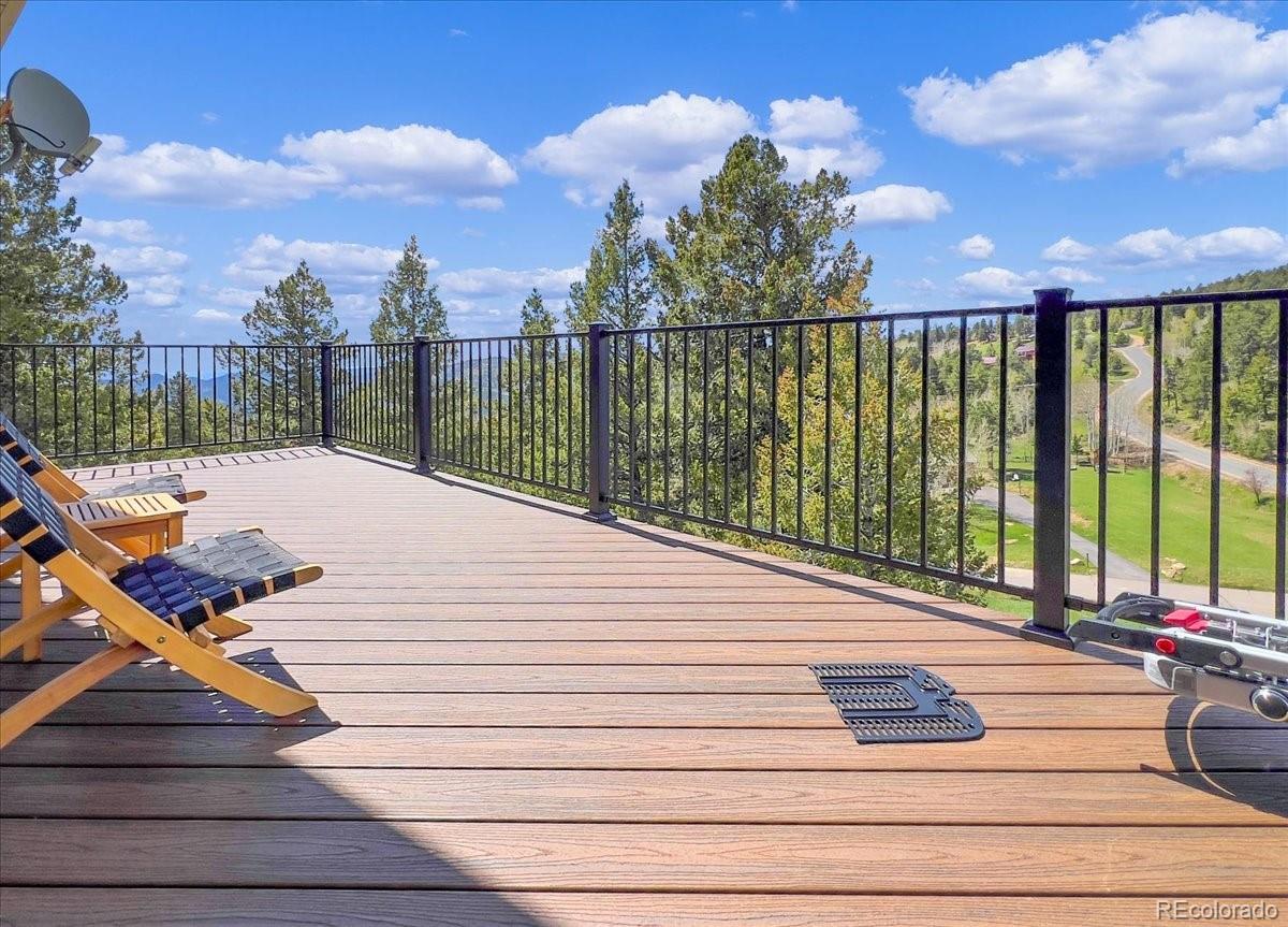 22155 Cook Lane Morrison, CO 80465 - Photo 21 of 28 a view of a terrace with sky view