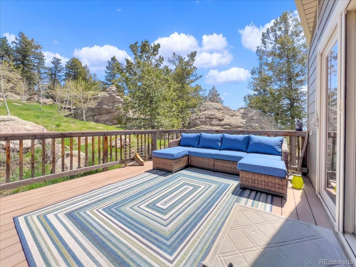 22155 Cook Lane Morrison, CO 80465 - Photo 22 of 28 a view of a two chairs in the roof deck