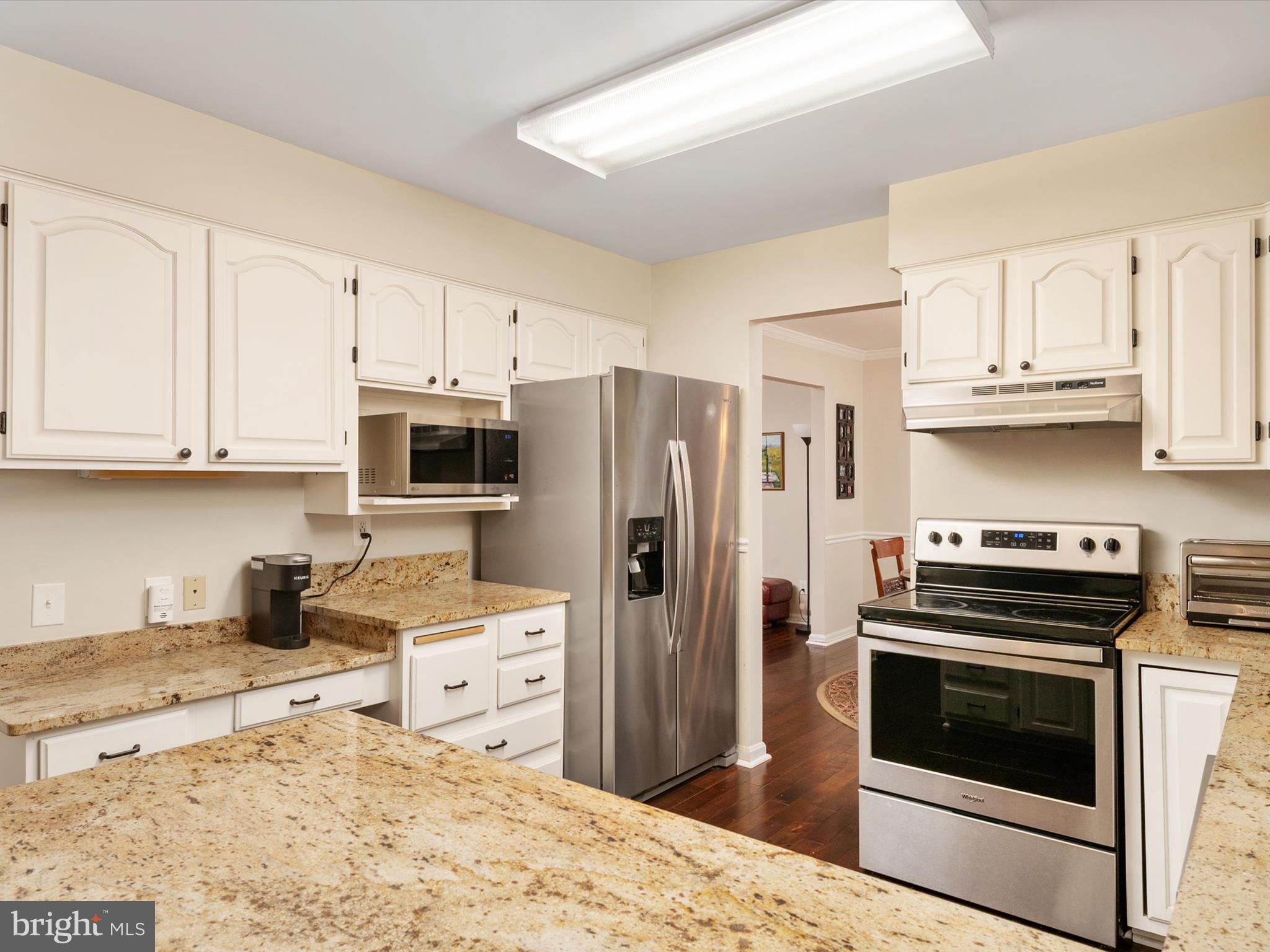1711 Peartree Lane Crofton, MD 21114 - Photo 17 of 65 a kitchen with stainless steel appliances granite countertop a refrigerator stove microwave and sink