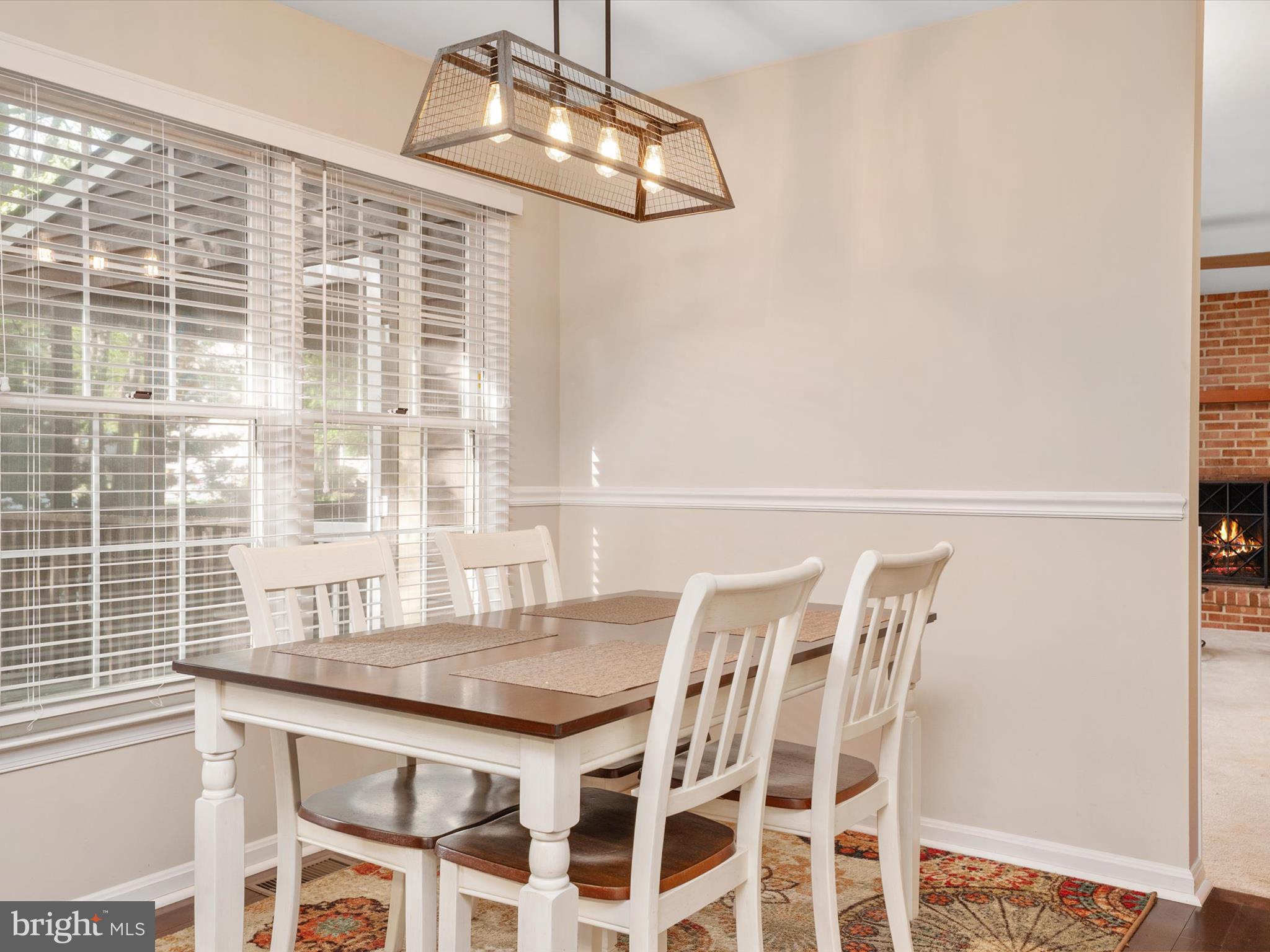1711 Peartree Lane Crofton, MD 21114 - Photo 18 of 65 a dining room with a table and chairs