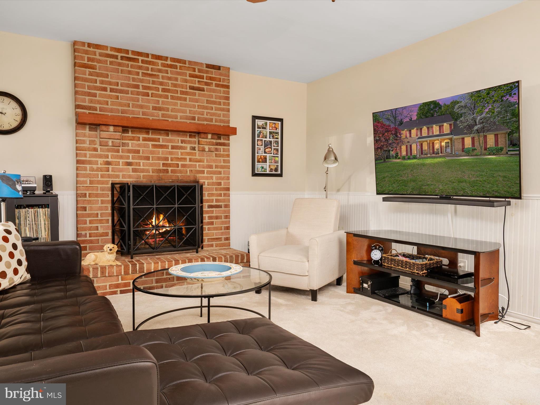 1711 Peartree Lane Crofton, MD 21114 - Photo 21 of 65 a living room with furniture a flat screen tv and a fireplace
