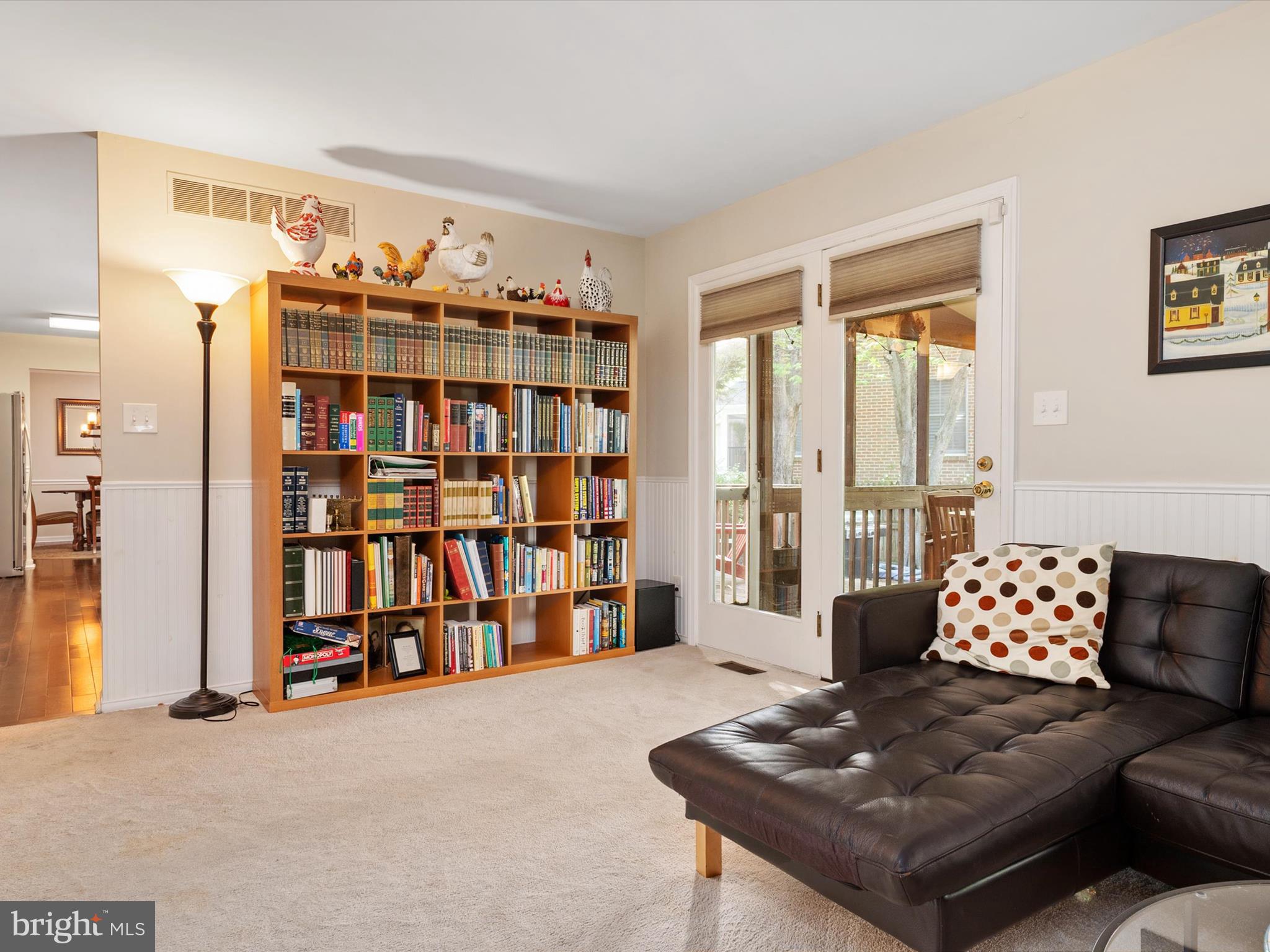 1711 Peartree Lane Crofton, MD 21114 - Photo 22 of 65 a living room with furniture and a book shelf