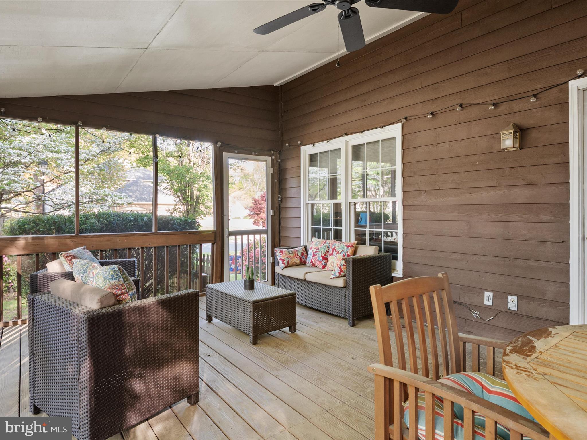 1711 Peartree Lane Crofton, MD 21114 - Photo 23 of 65 a living room with furniture and a floor to ceiling window