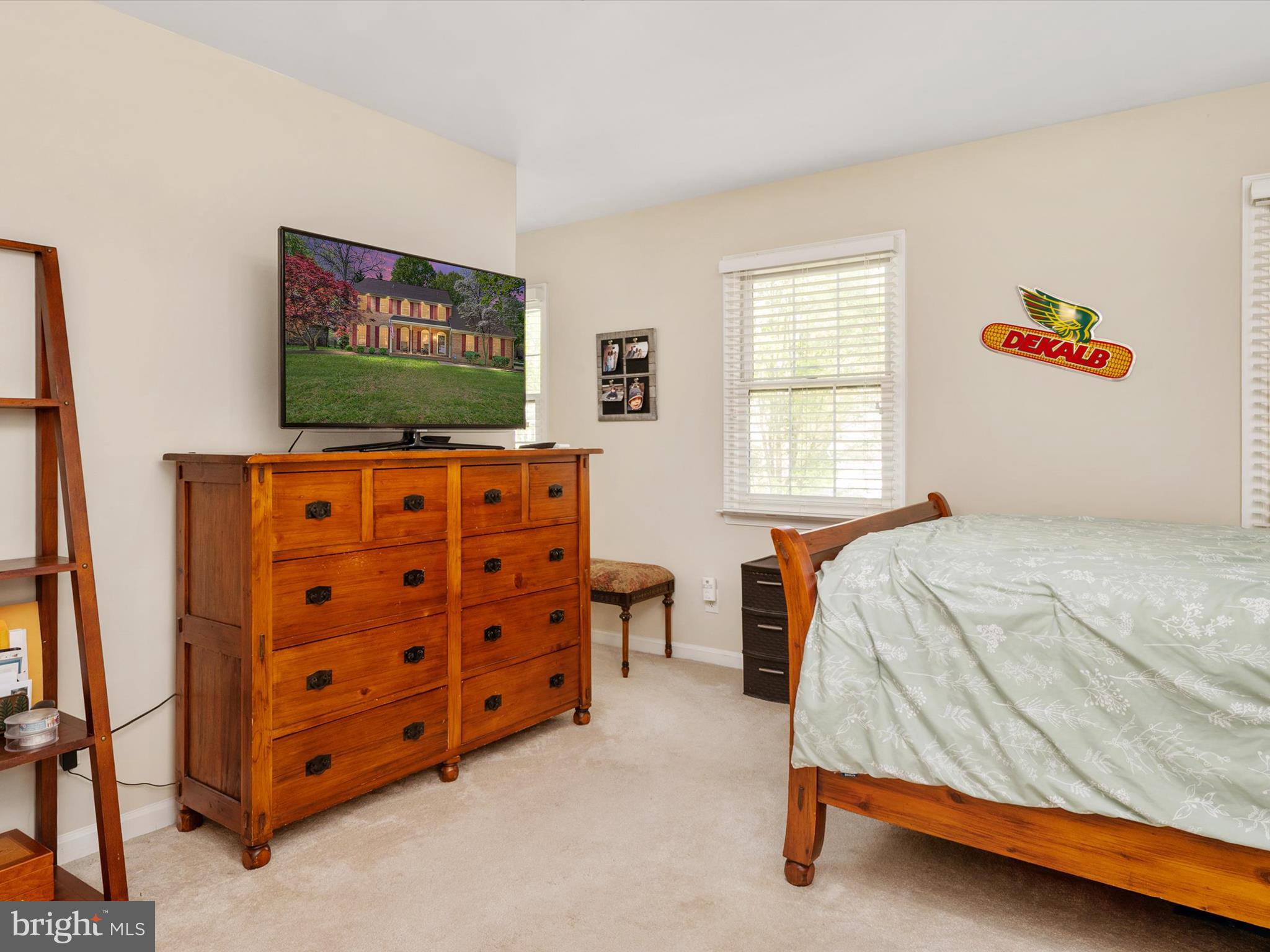 1711 Peartree Lane Crofton, MD 21114 - Photo 29 of 65 a bedroom with furniture and a flat screen tv