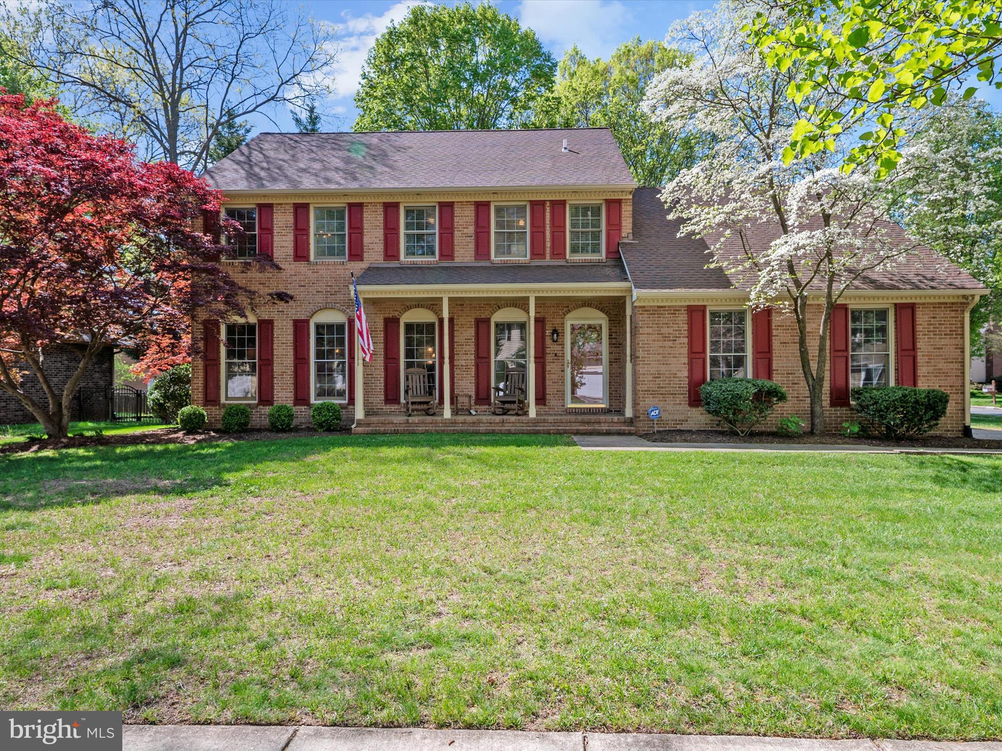 1711 Peartree Lane Crofton, MD 21114 - Photo 4 of 65 front view of a brick house with a yard