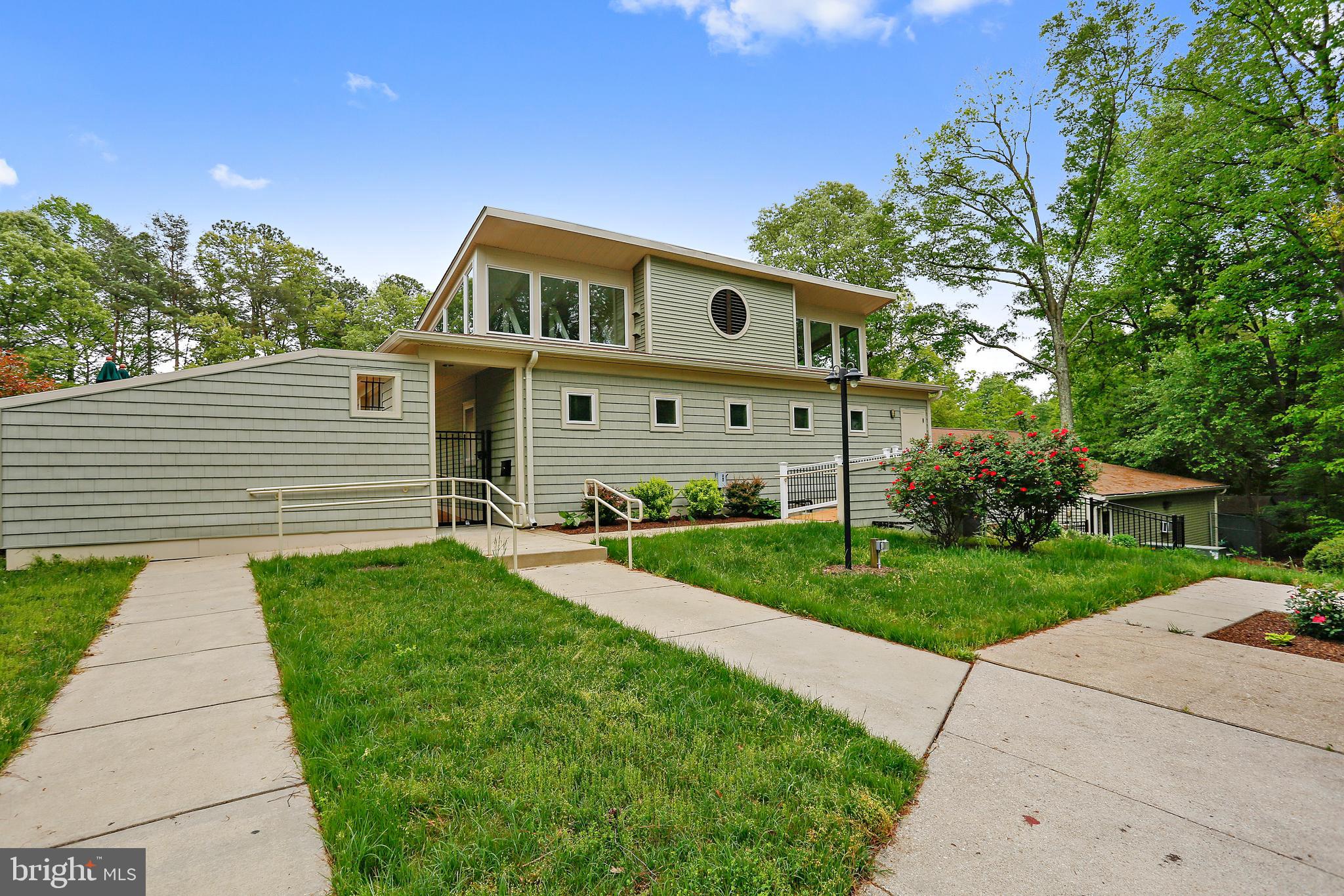 1711 Peartree Lane Crofton, MD 21114 - Photo 55 of 65 a front view of a house with a yard