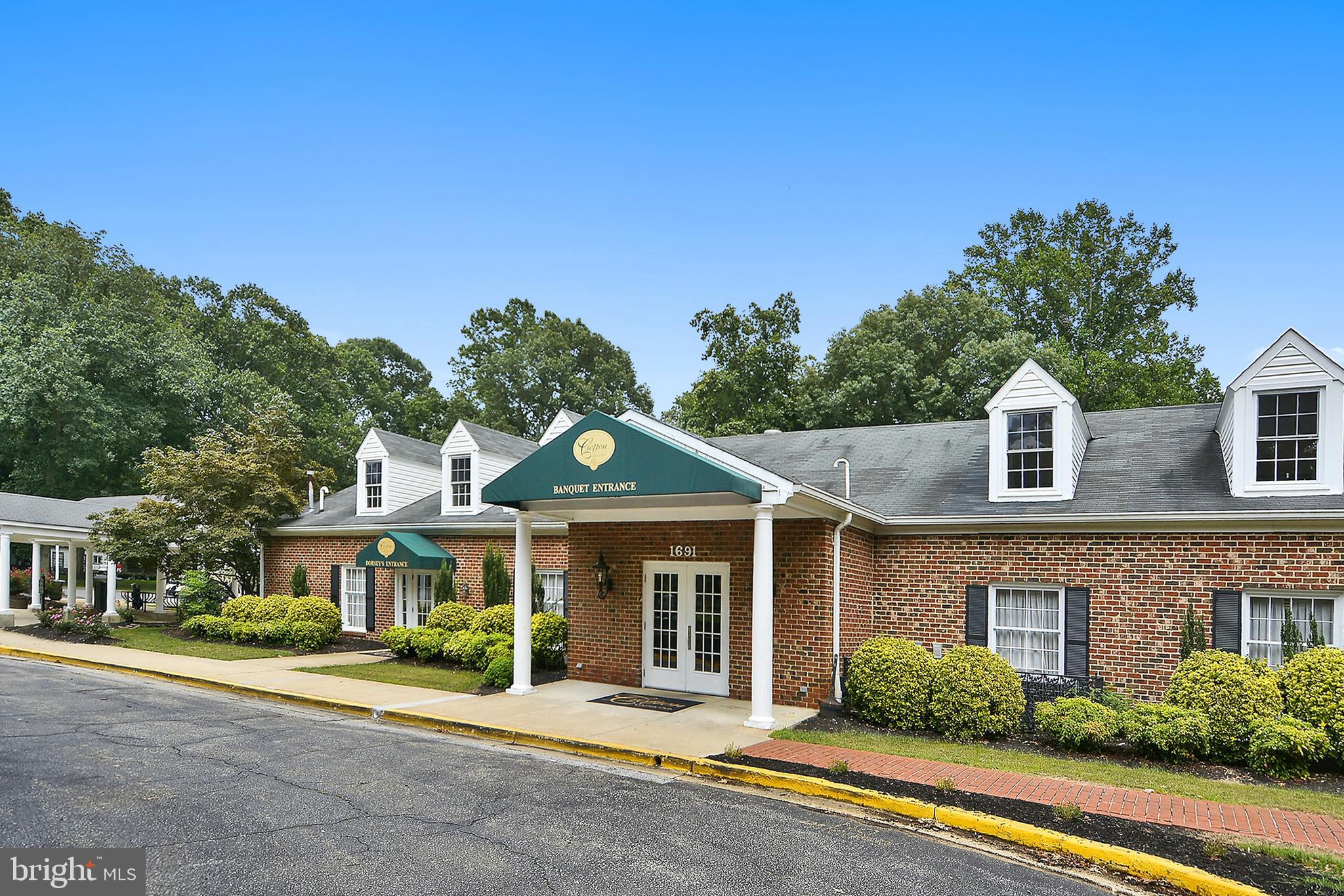 1711 Peartree Lane Crofton, MD 21114 - Photo 63 of 65 a front view of a house with a yard