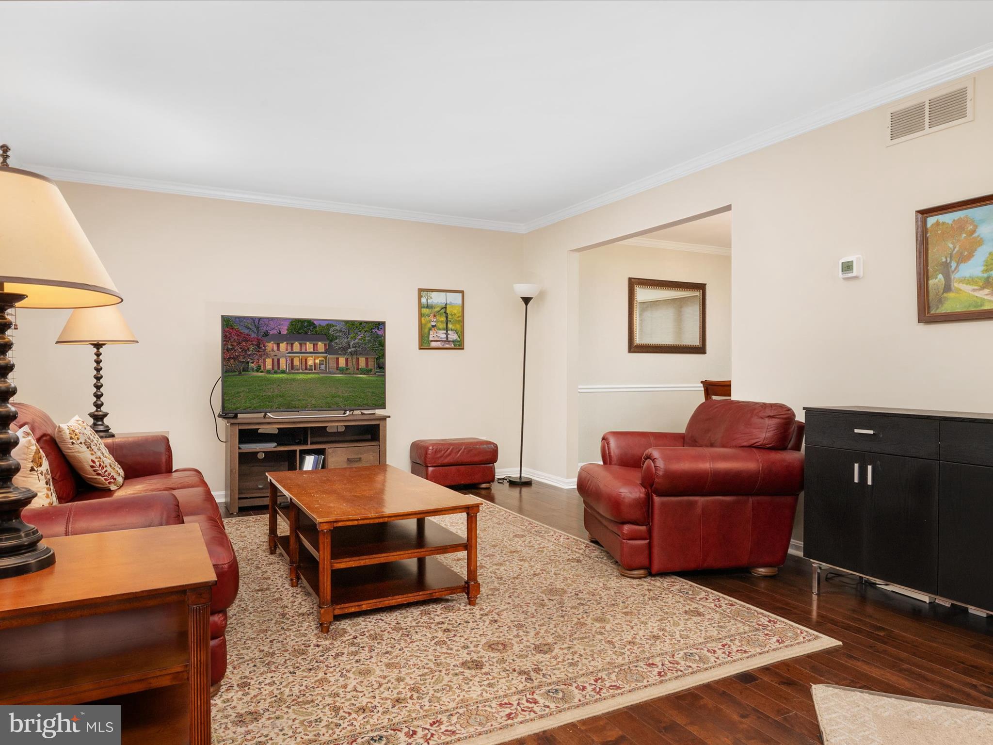1711 Peartree Lane Crofton, MD 21114 - Photo 10 of 65 a living room with furniture a flat screen tv and a window