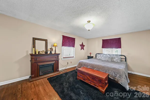 a bed room with a bed and dresser
