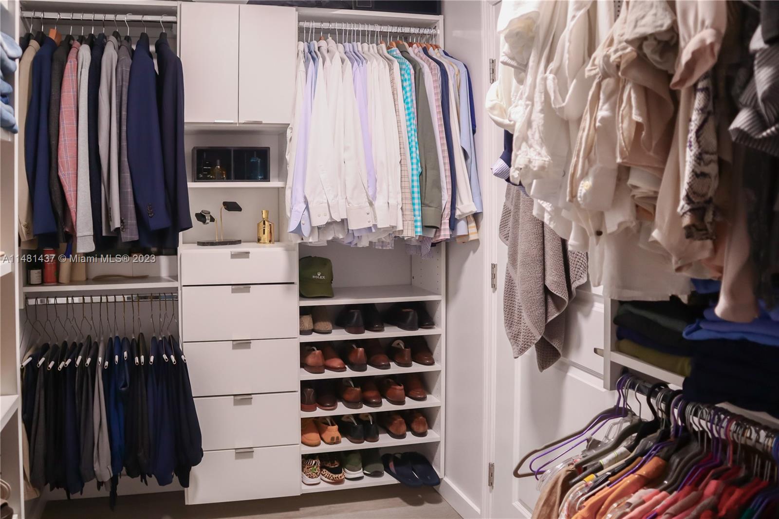 6704 Southwest 114th Place, Unit E Miami, FL 33173 - Photo 15 of 34 a view of walk in closet with clothes and shoes