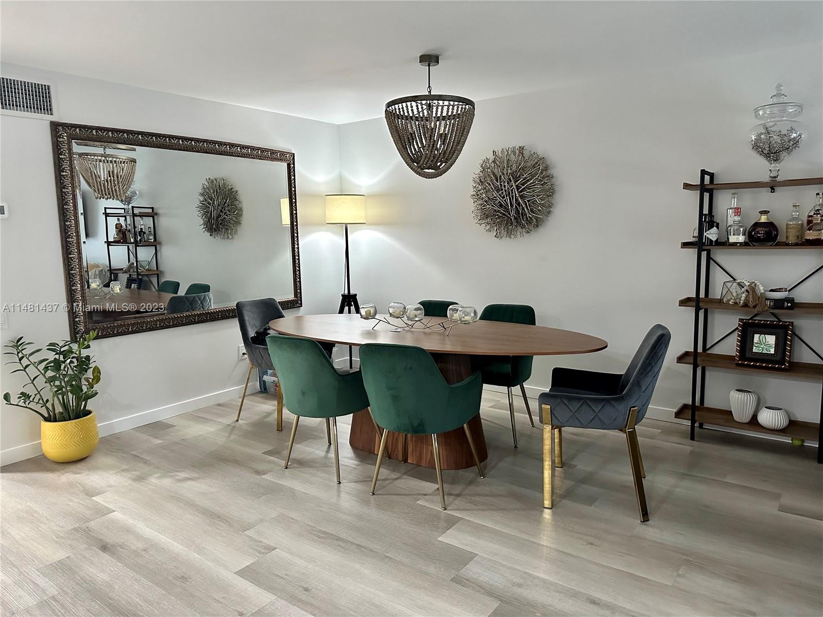 6704 Southwest 114th Place, Unit E Miami, FL 33173 - Photo 2 of 34 a dining room with furniture and window