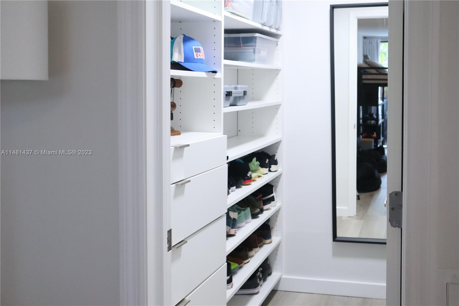 6704 Southwest 114th Place, Unit E Miami, FL 33173 - Photo 21 of 34 a view of small space with racks on the wall