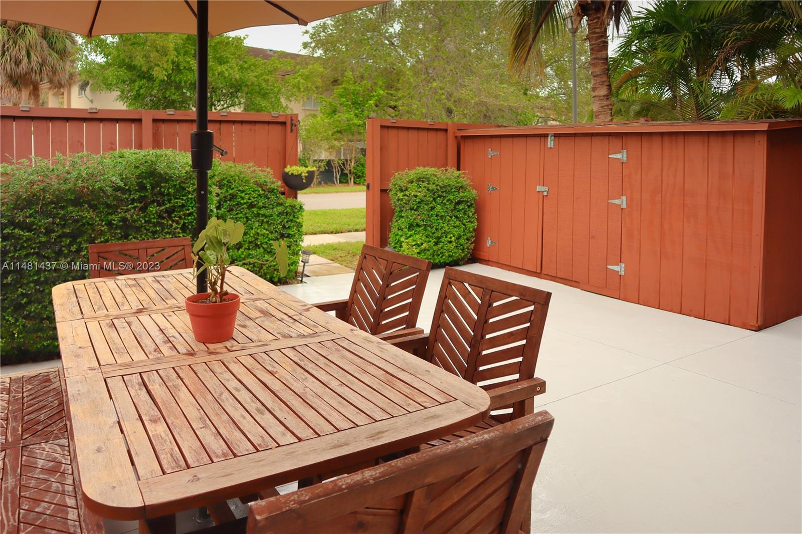 6704 Southwest 114th Place, Unit E Miami, FL 33173 - Photo 22 of 34 a view of outdoor space yard and patio