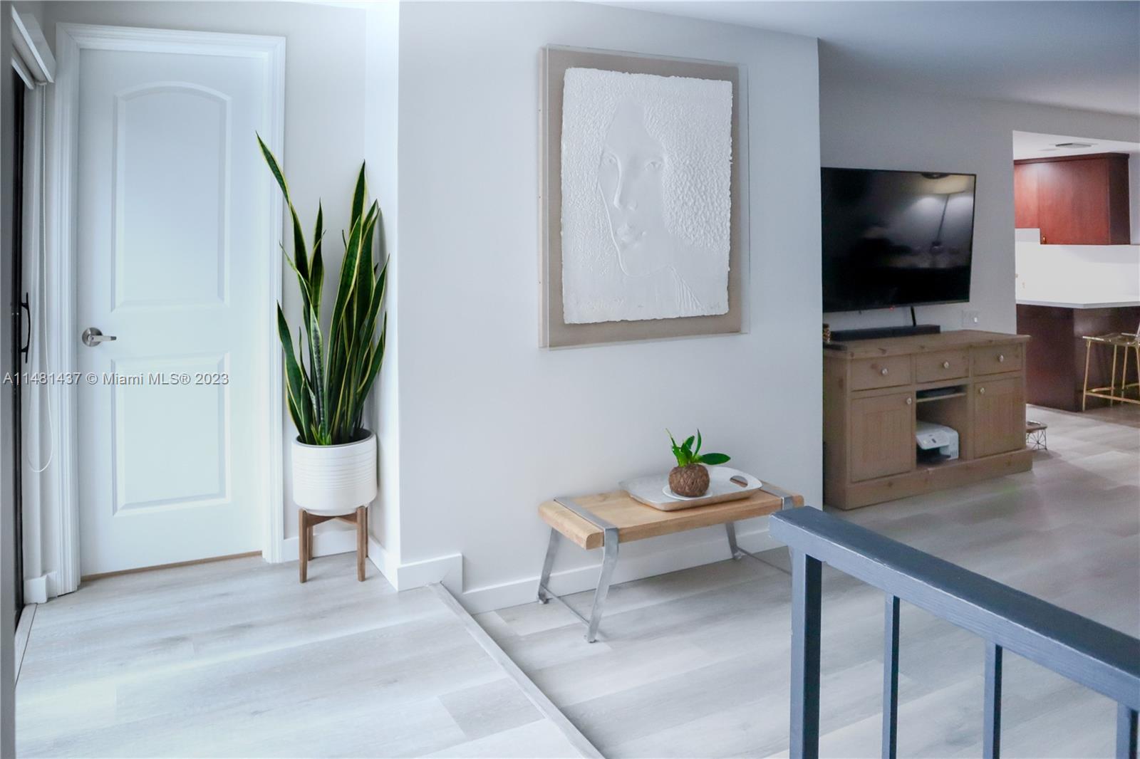 6704 Southwest 114th Place, Unit E Miami, FL 33173 - Photo 26 of 34 a living room with furniture and a flat screen tv