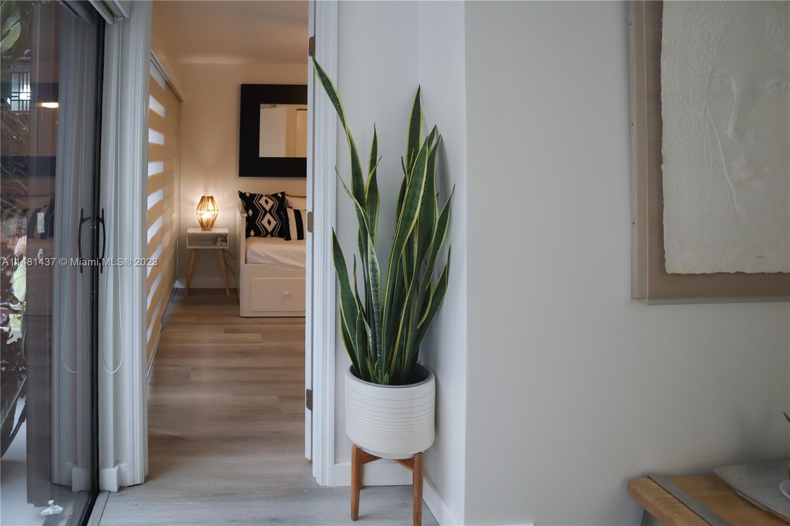 6704 Southwest 114th Place, Unit E Miami, FL 33173 - Photo 27 of 34 a view of a hallway with seating area