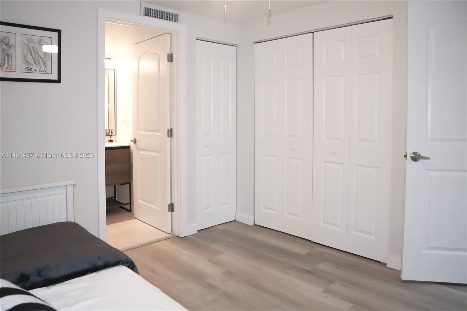 6704 Southwest 114th Place, Unit E Miami, FL 33173 - Photo 29 of 34 a view of a bedroom with an empty space