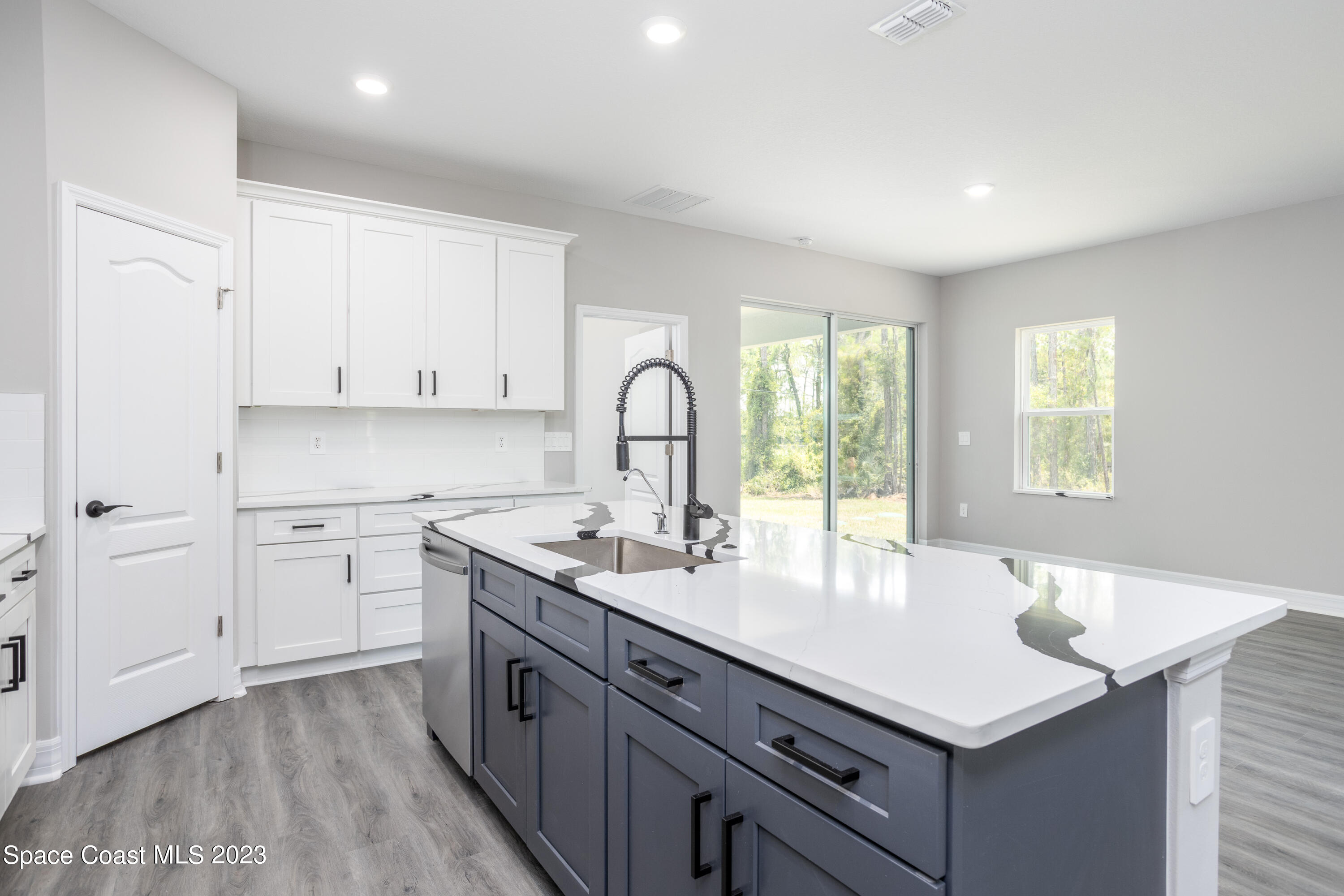1007 San Rafael Road Southwest Palm Bay, FL 32908 - Photo 11 of 23 a kitchen with a sink cabinets and window