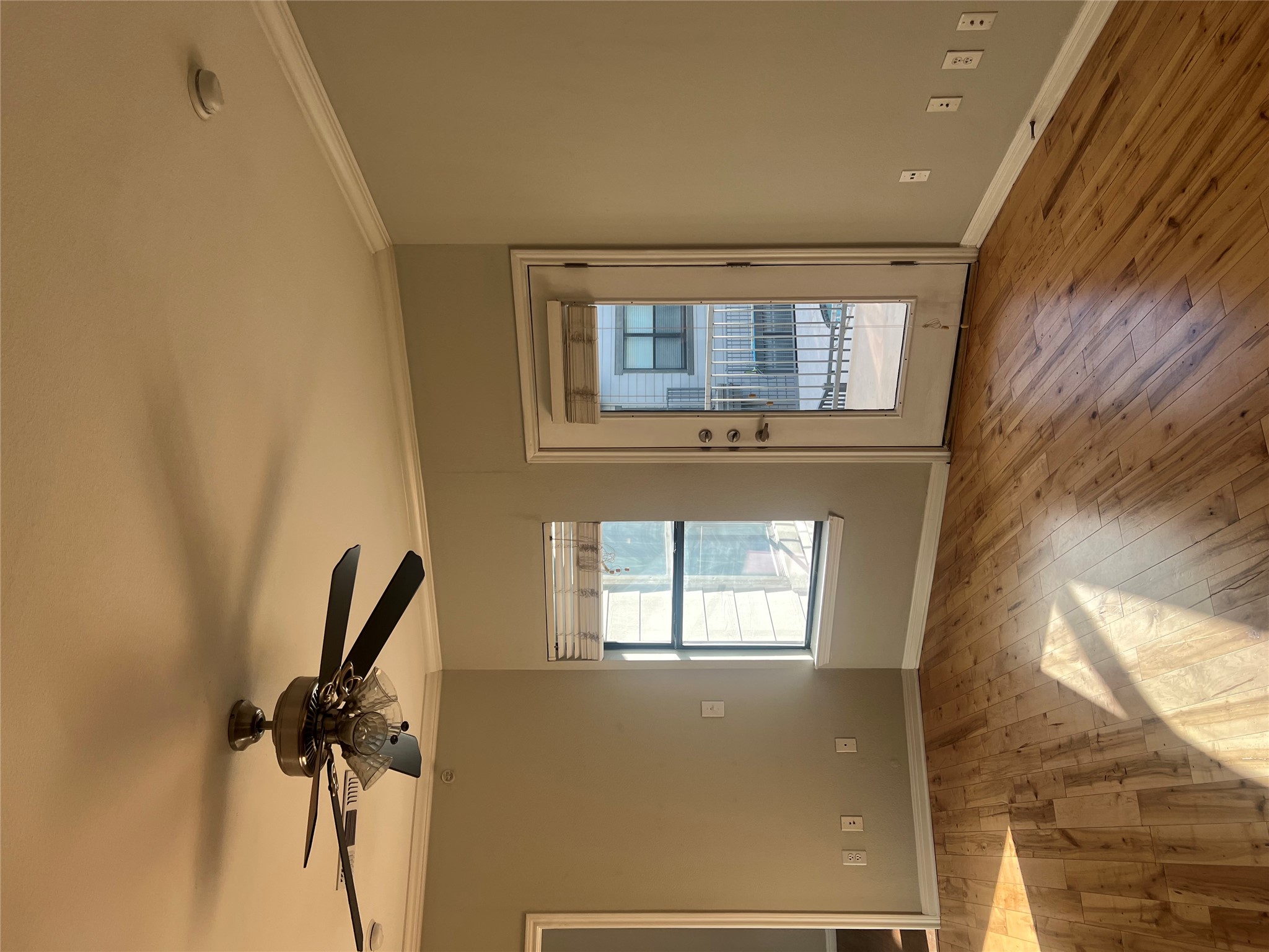2502 Leon Street, Unit 301 Austin, TX 78705 - Photo 11 of 15 Living room has lots of light. Door to balcony overlooking the pool.