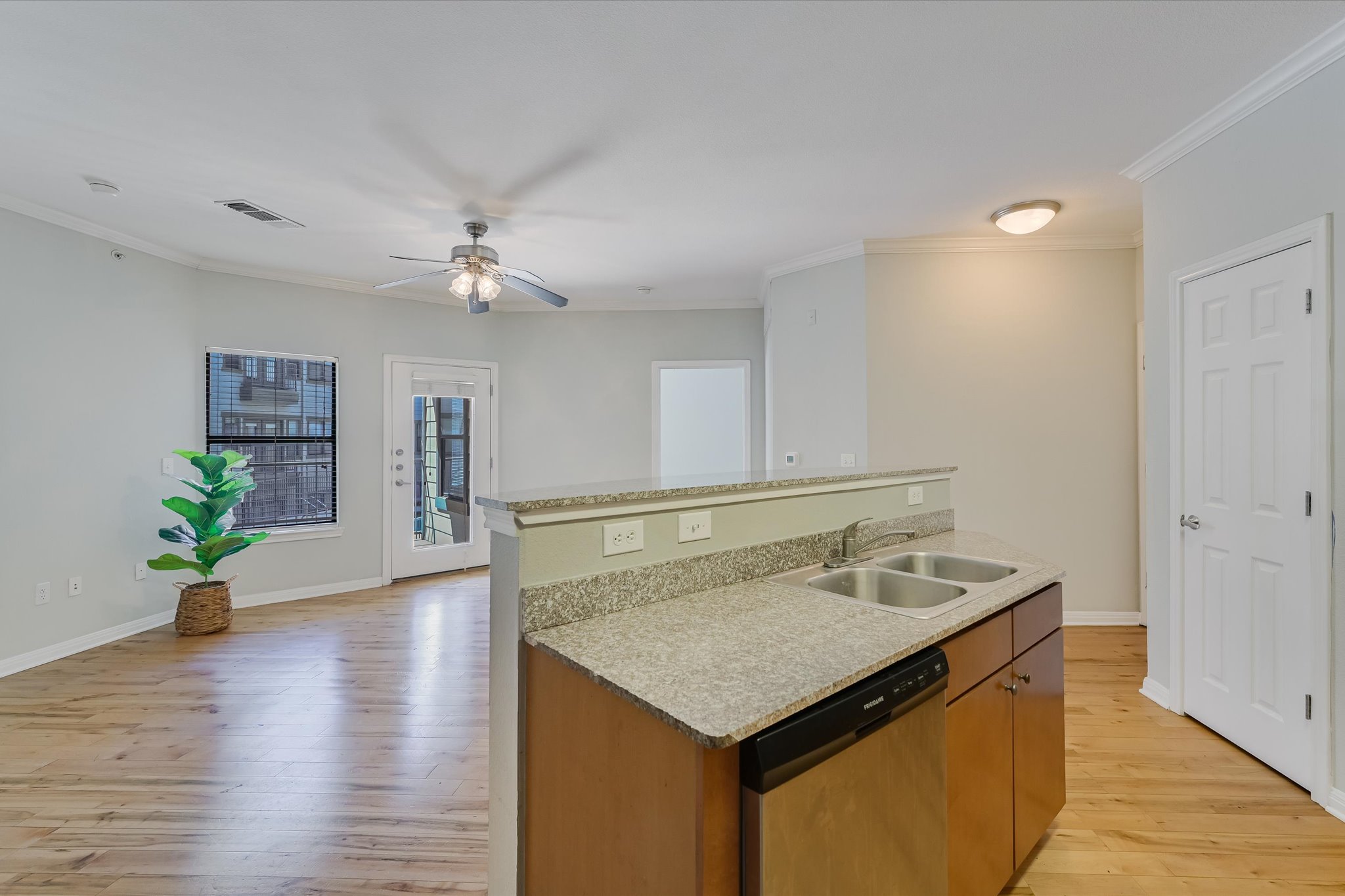 2502 Leon Street, Unit 301 Austin, TX 78705 - Photo 3 of 15 Kitchen is separated from the living area by a counter with overhang for barstools.