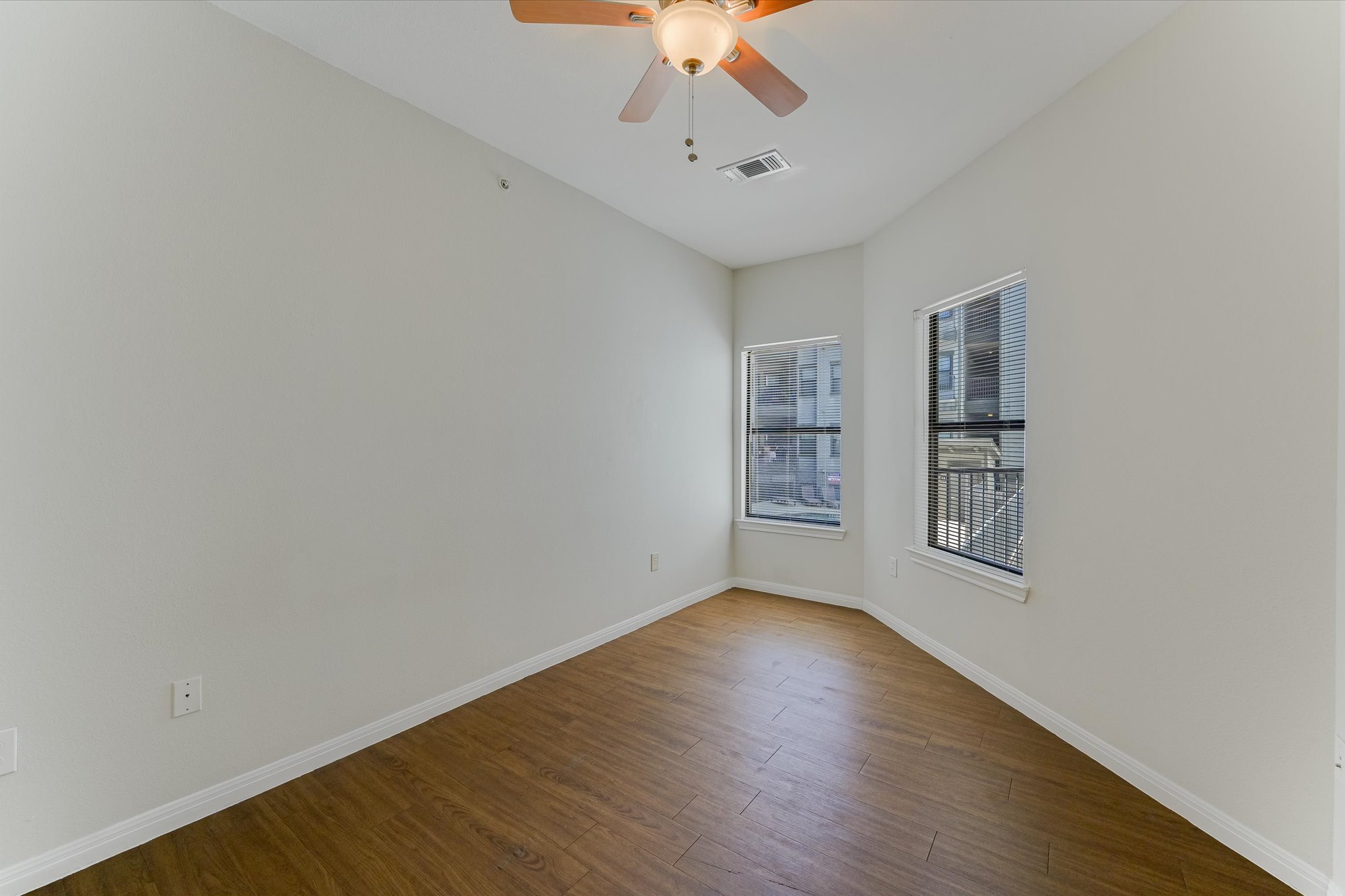 2502 Leon Street, Unit 301 Austin, TX 78705 - Photo 7 of 15 Angular second bedroom with ceiling fan