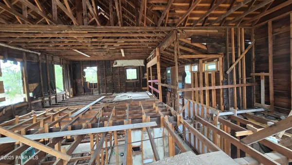a sitting area with wooden floor