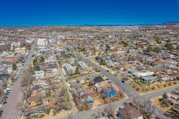 a view of a yard with a city view