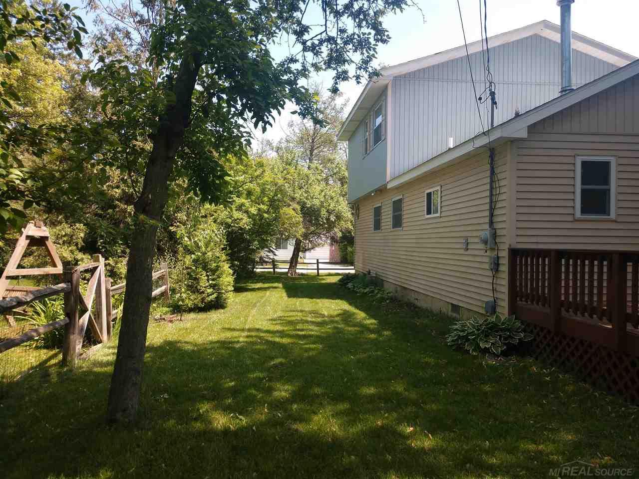 7290 Longfellow Road Lexington, MI 48450 - Photo 3 of 28 Back of home