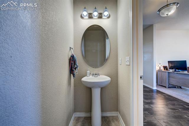 11353 Avena Road Peyton, CO 80831 - Photo 21 of 46 Half bath right off the office