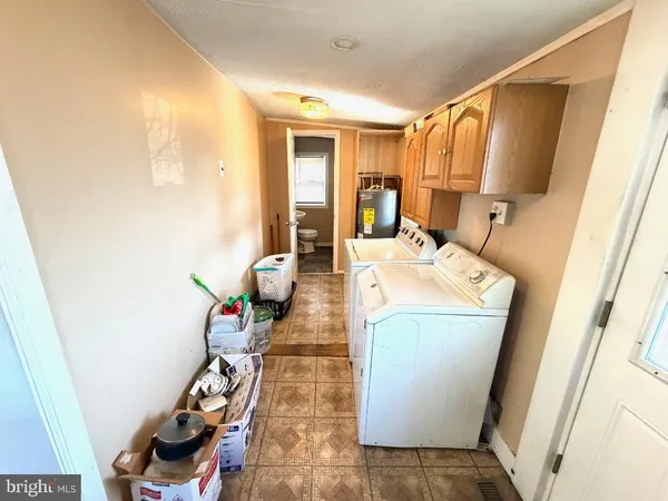 a view of living room with furniture and a wooden floor