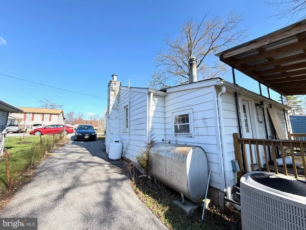 a view of a backyard with a small deck