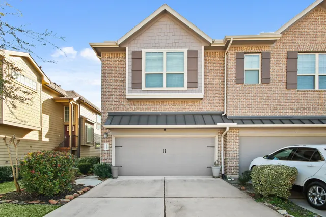 a view of a house with a parking space