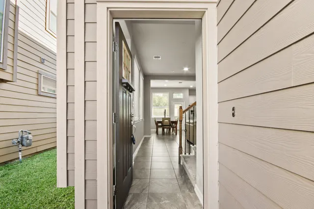 a view of a hallway with a outdoor space