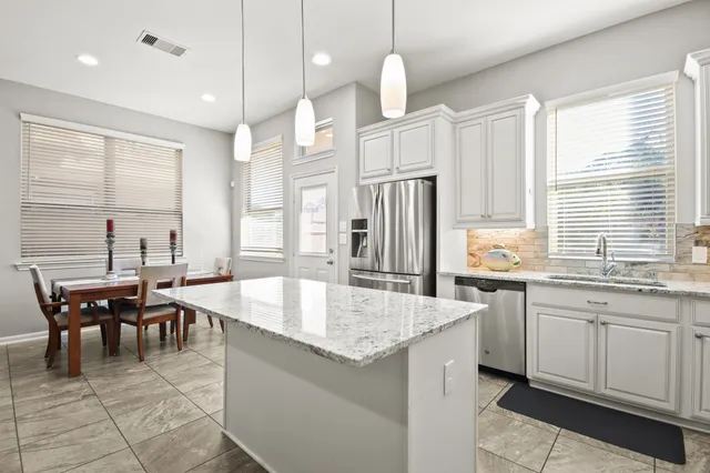 a large kitchen with lots of counter space and appliances