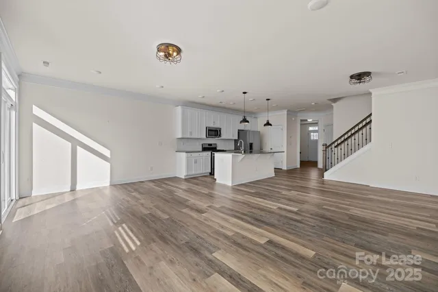 a view of kitchen and wooden floor