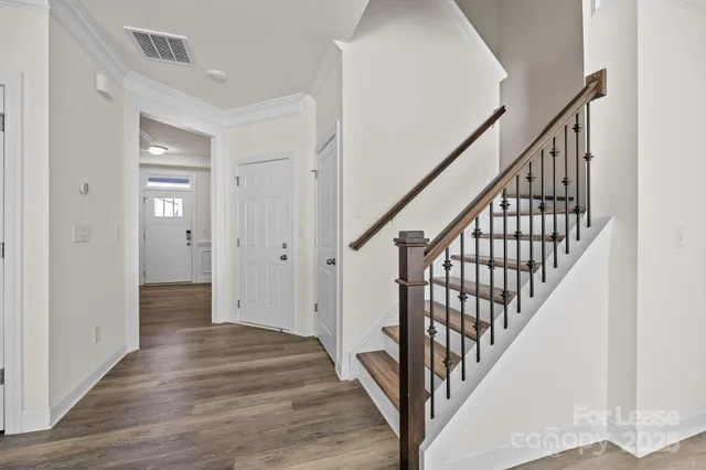 a view of an entryway with wooden floor