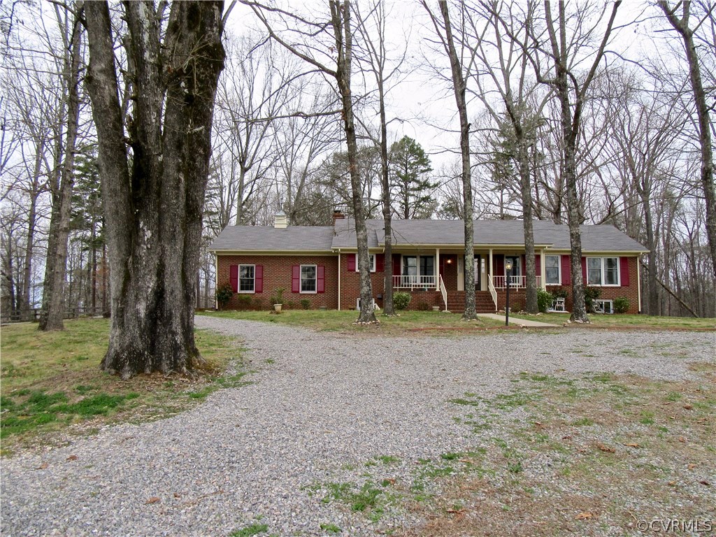 3092 Lowry Road Columbia, VA 23038 - Photo 1 of 34 a front view of a house with a garden