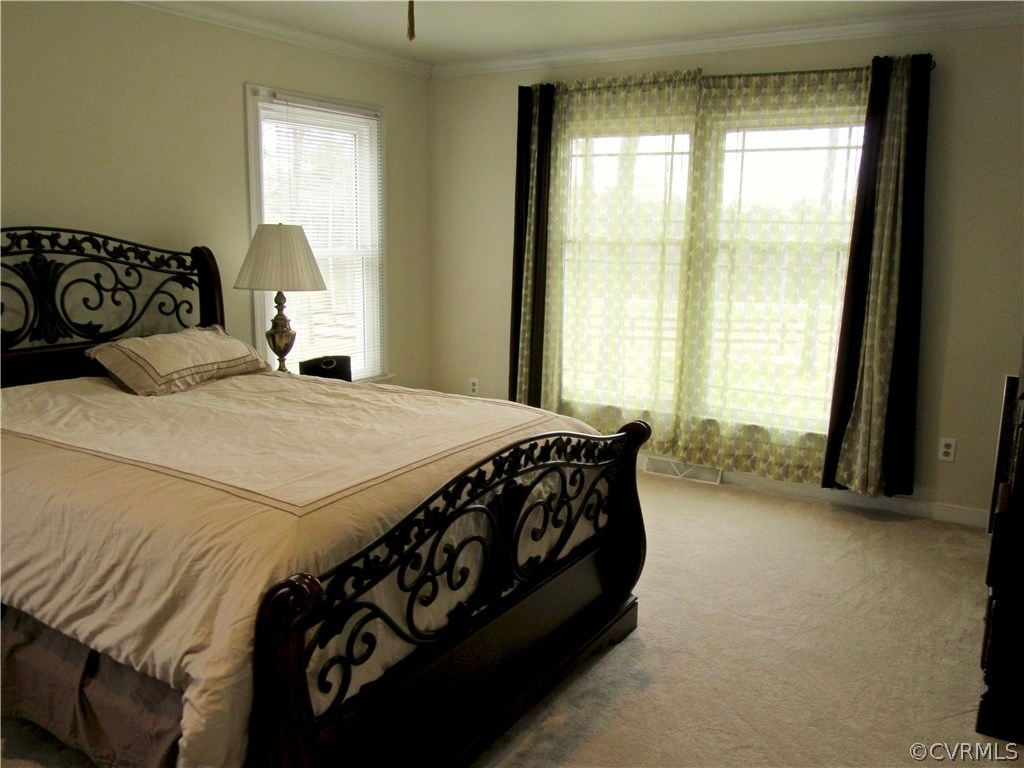 3092 Lowry Road Columbia, VA 23038 - Photo 11 of 34 a bedroom with a bed next to a window