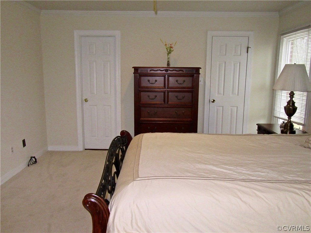 3092 Lowry Road Columbia, VA 23038 - Photo 12 of 34 a bedroom with a bed and a mirror