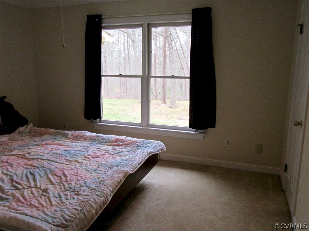 3092 Lowry Road Columbia, VA 23038 - Photo 13 of 34 a bedroom with a bed and a window