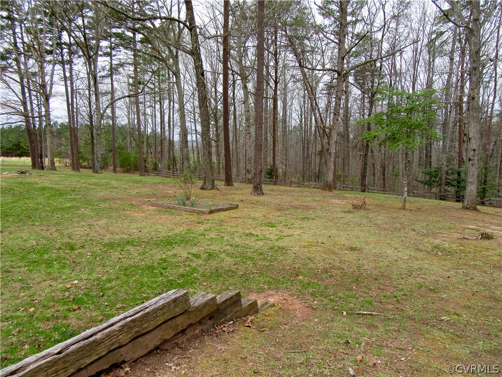3092 Lowry Road Columbia, VA 23038 - Photo 26 of 34 a backyard of a house with large trees