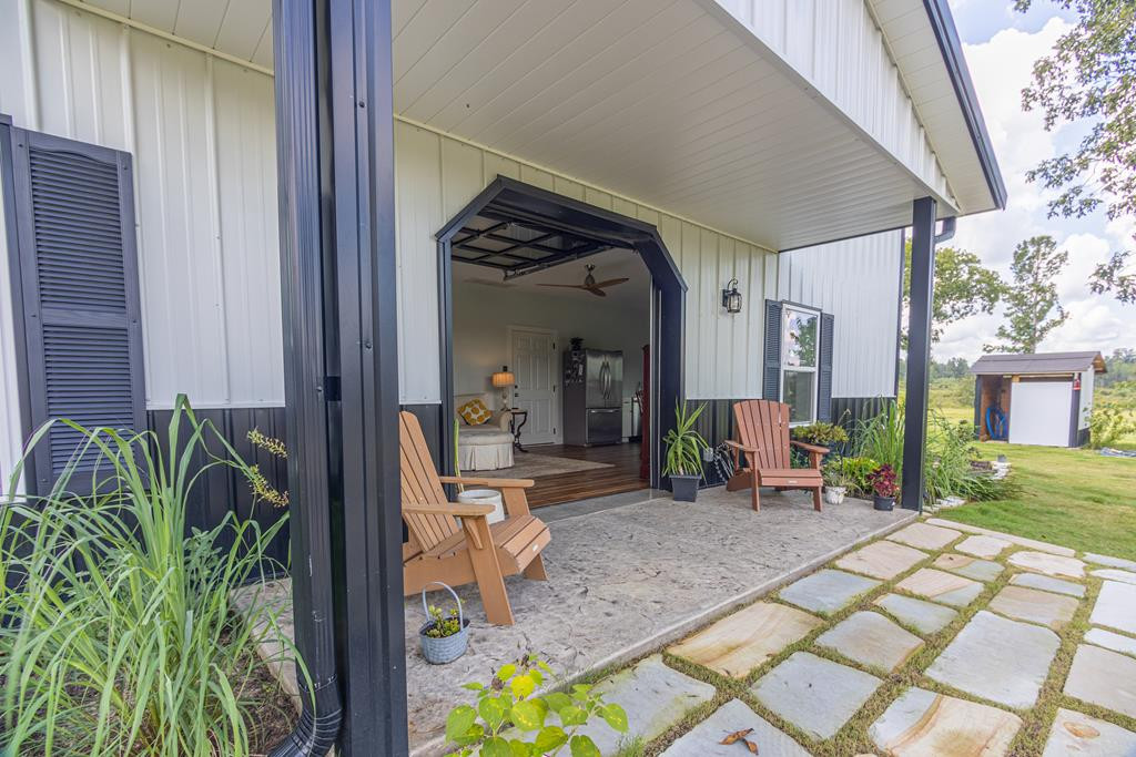 775 Colbert Bridge Road Windsor, SC 29856 - Photo 28 of 33 a view of a porch with chairs and potted plants
