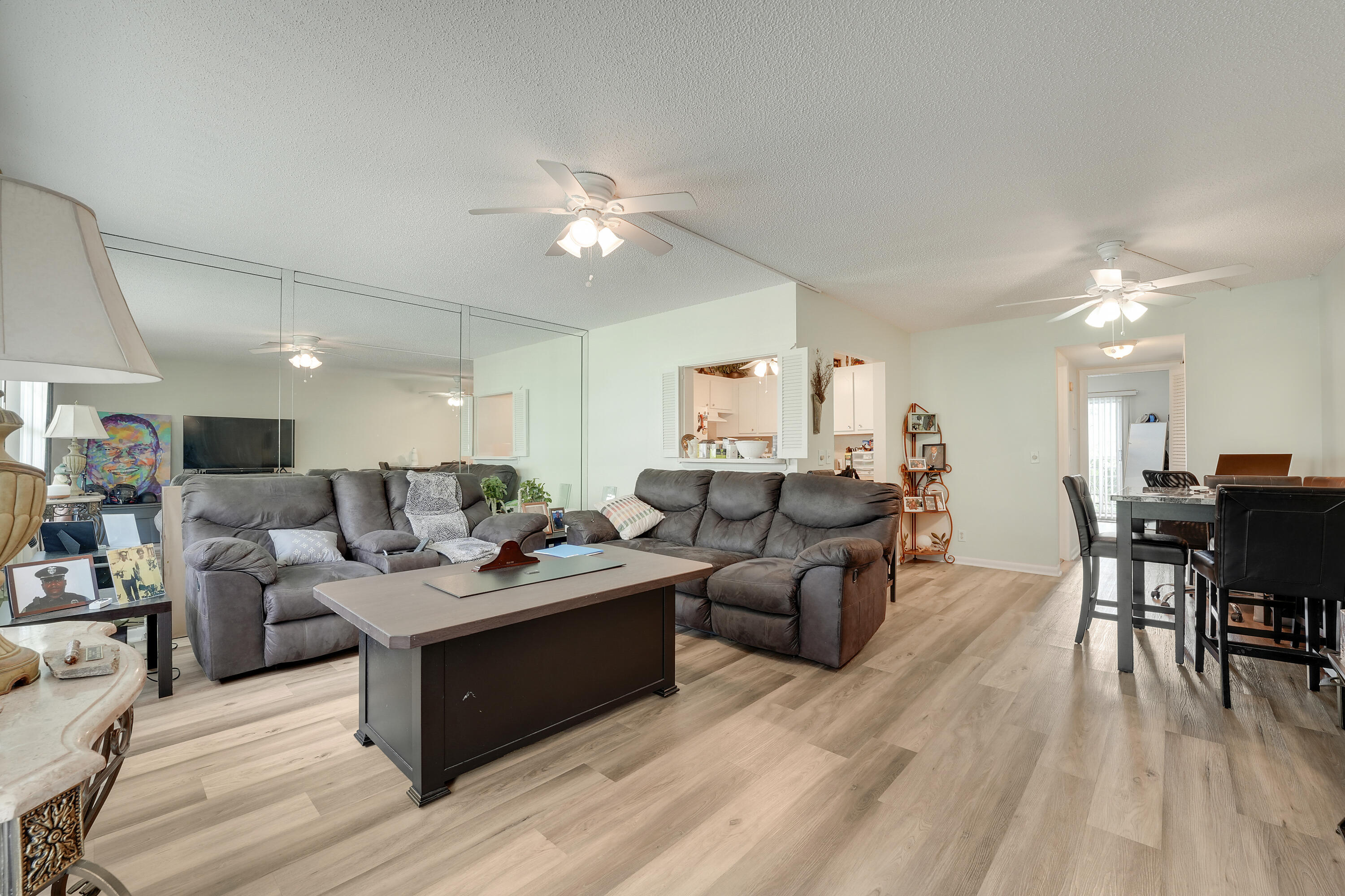 146 Mansfield D Boca Raton, FL 33434 - Photo 3 of 12 a living room with furniture and a wooden floor