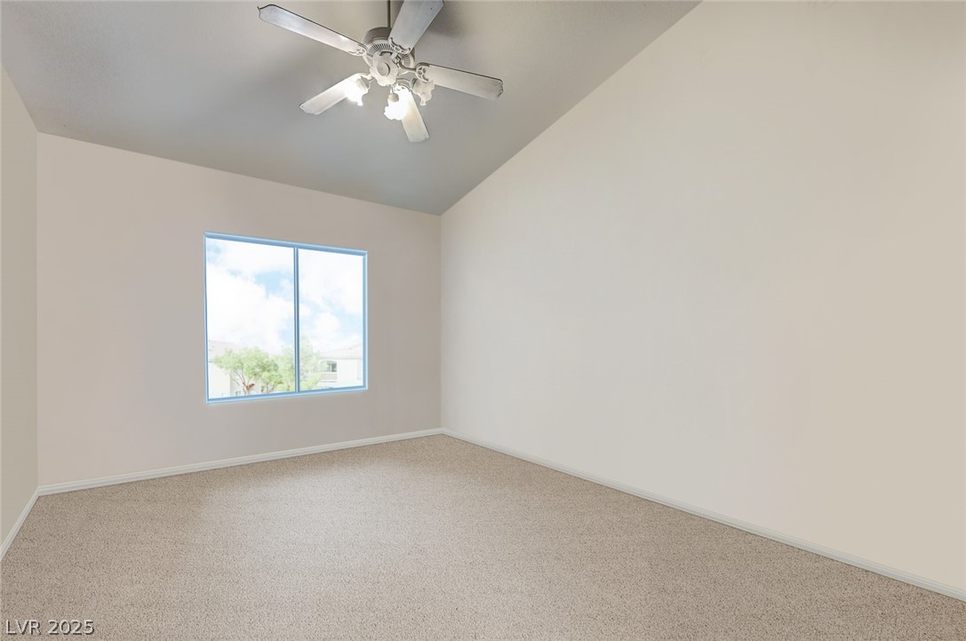 2305 West Horizon Ridge Parkway, Unit 1223 Henderson, NV 89052 - Photo 16 of 28 Unfurnished room with carpet, a ceiling fan, and lofted ceiling