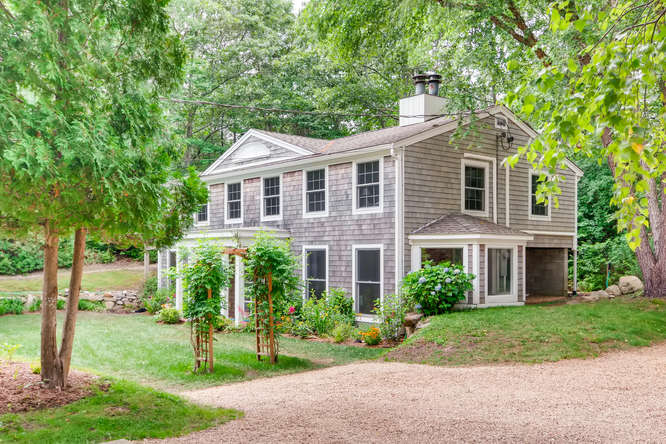 345 N Road Chilmark, MA 02535 - Photo 2 of 26 a front view of a house with a yard