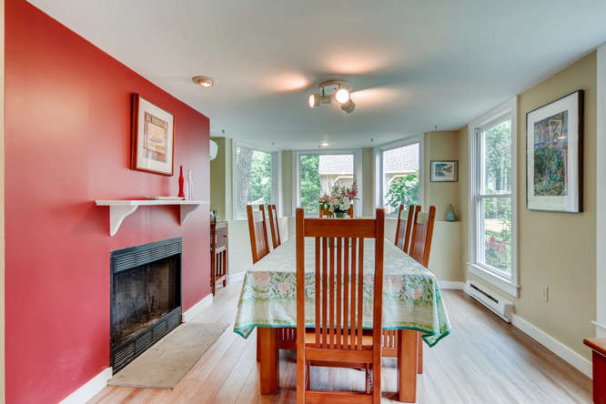 345 N Road Chilmark, MA 02535 - Photo 15 of 26 a view of a livingroom with furniture a fireplace and wooden floor