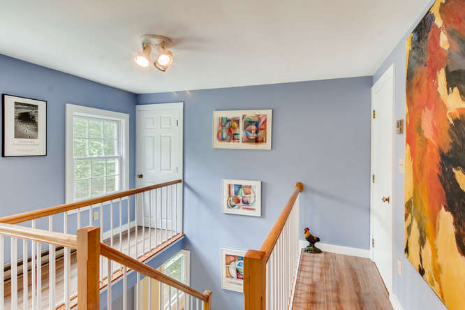 345 N Road Chilmark, MA 02535 - Photo 16 of 26 a view of a hallway with windows and wooden floor