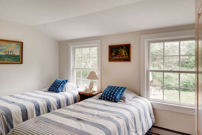 345 N Road Chilmark, MA 02535 - Photo 19 of 26 a bedroom with two beds and a window